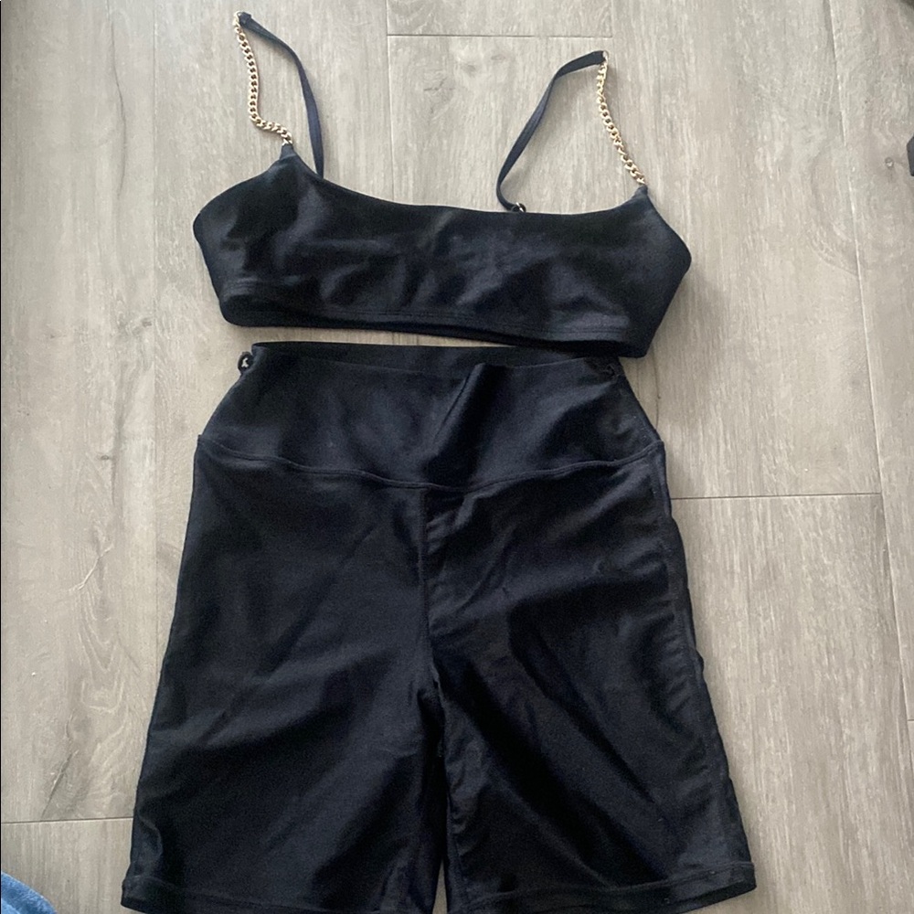 N/A.          Black Two-Piece Workout Set with Gold Chain Straps